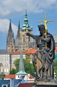 Stone statues on both sides of the Charles Bridge in Prague have preserved hi Stock Photos