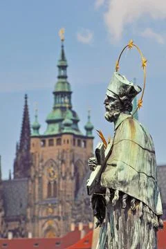 Stone statues on both sides of the Charles Bridge in Prague have preserved hi Stock Photos