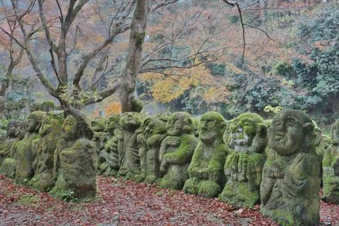 The stone statues representing disciples of Buddha. Stock Photos