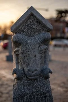 The stone statuette representing a ram with horns Stock Photos