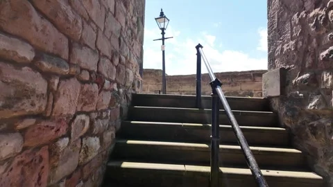 Stone Steps beside Historic Town Wall and Victorian Street Lamp Video stock 346369460