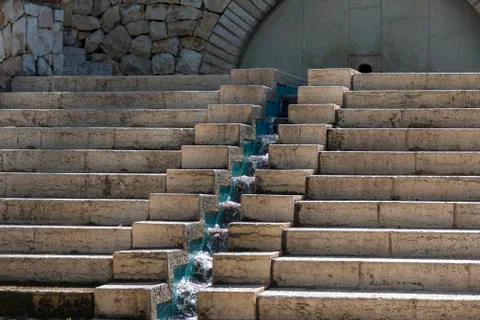 Stone steps bottom view in the middle of a stream of water. Stock Photos