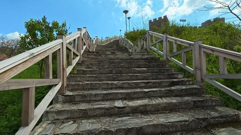 Stone steps climb toward ancient castle walls. Ram Fortress, Serbia Видео 332545414