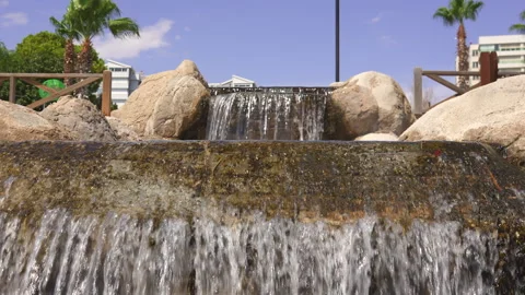 Stone Steps Flowing with Water, Creating a Beautiful Waterfall Stock Footage 285773315