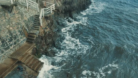 The stone steps lead into the sea Stock Footage 94604444