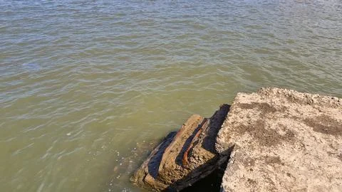Stone steps leading to the sea Stock Photos
