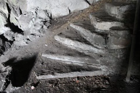 Stone steps in a natural cave Stock Photos
