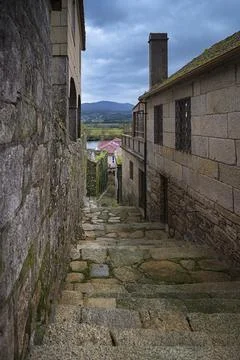 Stone steps winding down old town alleyway Fotos de archivo