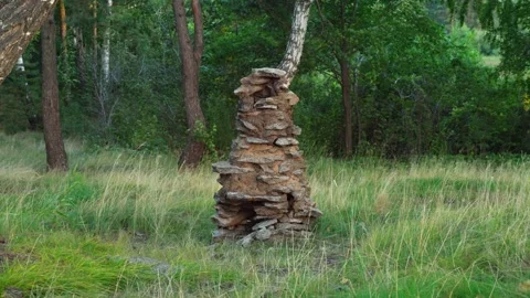 A stone stove for a camp bath, built in a forest in a clearing. Stock Footage 283082834