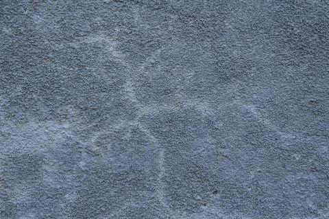 A stone surface with cracks, spots, irregularities. Stock Photos