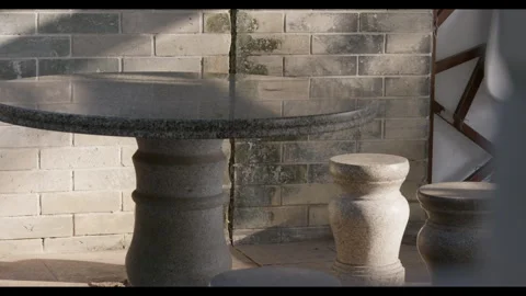 Stone Table and Stools in Outdoor Pavilion, Shadow Movement Video stock 330709669