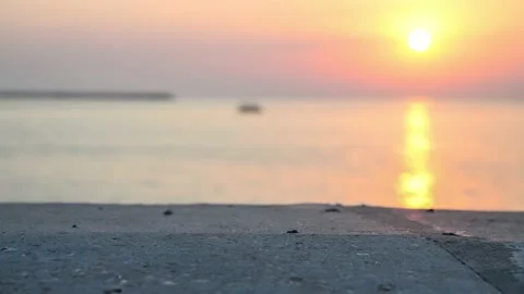 Stone table surface and blurred sunset sea Stock Footage 158434074