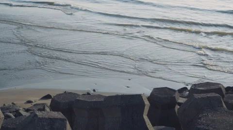 Stone tetrapod blocks on the beach Stock Footage 64116319