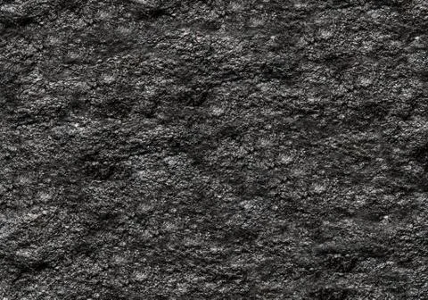 Stone texture background dark black grainy natural base Stock Photos