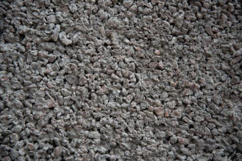 Stone texture background Wallpaper. Small stones of different shades. Stock Photos