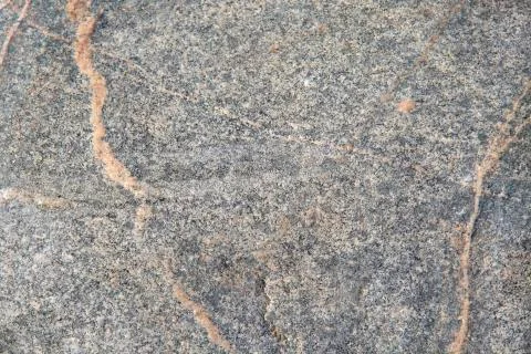 Stone texture on the beach. Copy space. Stock Photos