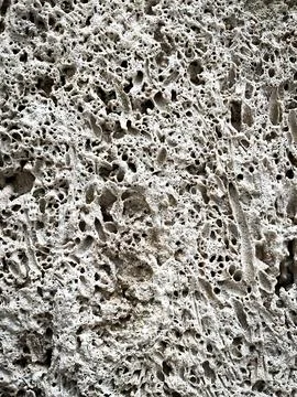 Stone texture. Close-up view of cliff shore or wall of ancient house, castle Stock-Fotos