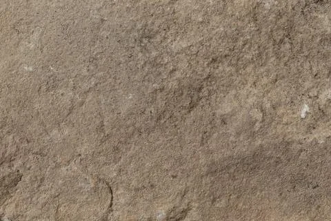 Stone texture in earthy brown tones with natural rugged details for backgrounds. Stock Illustration