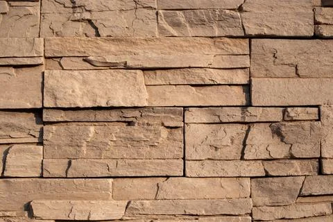 Stone texture. Layered stone material. Decorative wall surface Stockfoto's
