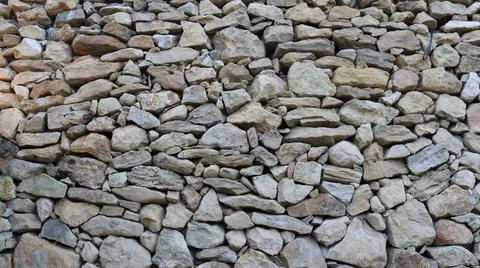 Stone texture made of gray solid natural blocks Stock Photos