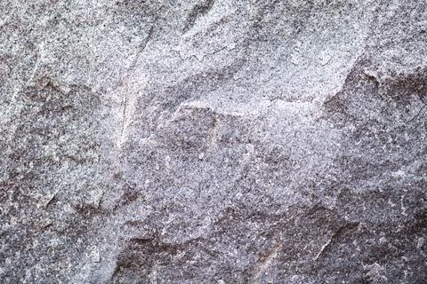 Stone texture with natural pattern. Gray rock surface detail. Rough mineral.. Stock Photos
