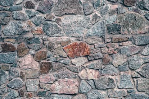Stone texture. Old stonework. Garden wall. The streets of the old city are .. Stock Photos