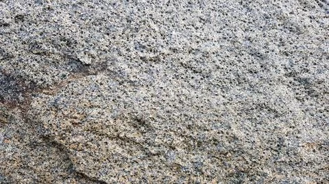 Stone texture or background. Coarse cracked stone structure of the face. empt Stock-Fotos