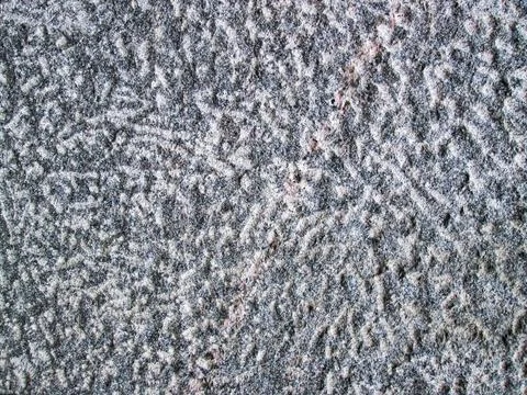 Stone texture with pink stripe. Rough surface of a hard mineral. Stock Photos
