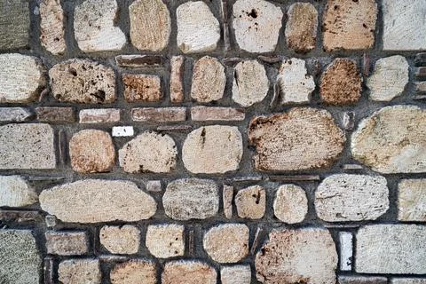 Stone texture, stone wall background. an old shabby wall made of stone textured Stock Photos