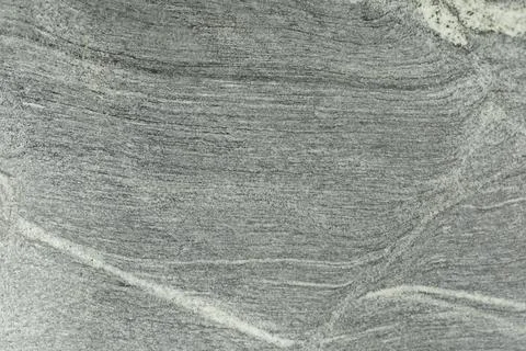 Stone texture with white splashes. Pattern on the rock. Stock Photos