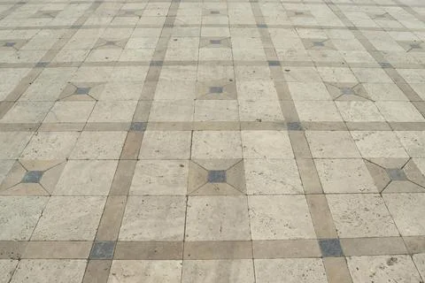 Stone tile pavement with geometric square pattern Stock Photos
