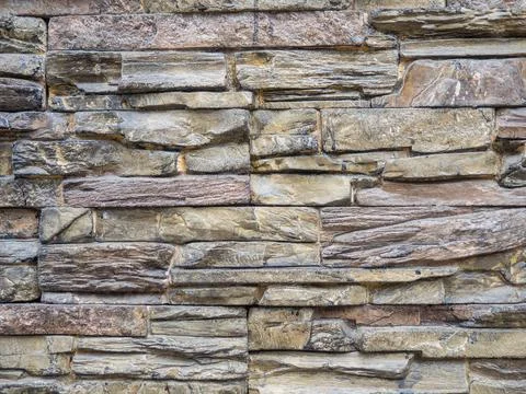 Stone tiles. House facade cladding design. Masonry. Stock Photos