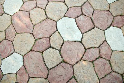 Stone tiles with sprouting grass Stock Photos