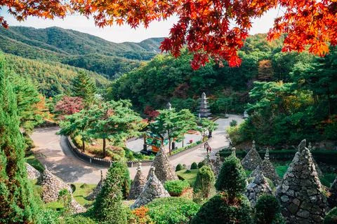 Stone tower with autumn maple tree in Wawoo Temple, Korea Stock Photos