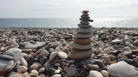 Stone tower on the beach Stock Photos