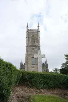 Stone Tower of Down Cathedral with Celtic High Cross in Downpatrick Stock Photos