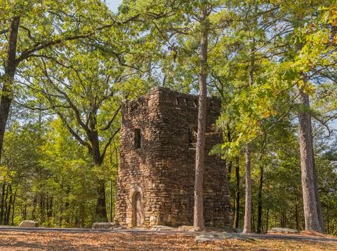 Stone tower in forest Stock Photos