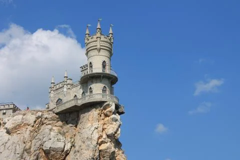 Stone tower, a fortress on a rocky cliff Stock Photos