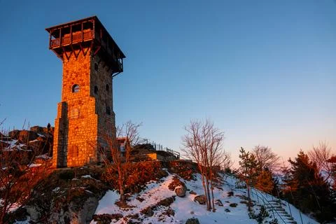 Stone tower on a High Stone in Jizera Mountains at sunset. Szklarska Poreba.. Stock Photos