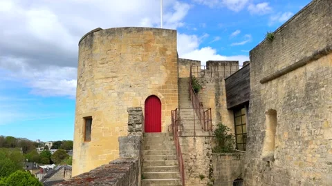 Stone tower with red arched door and stairway in historic Caen fortress 스톡 동영상 308319408
