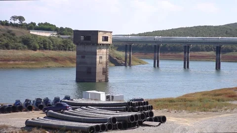 Stone tower in river and bridge Stock Footage 132587455