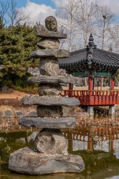 Stone tower in small pond Stock Photos