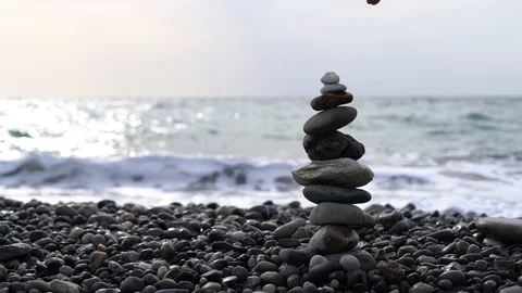 Stone tower unsuccessful attempt. Slow motion Stock Footage 128916962