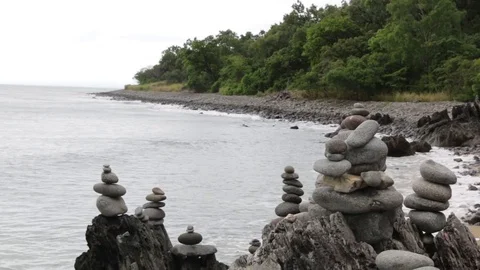 Stone towers built on beach Stock Footage 71231468