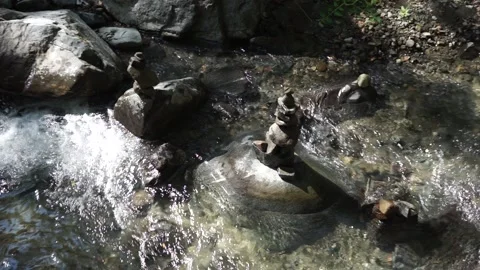 Stone towers in the stream Stock Footage 166580757