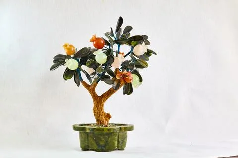 Stone tree made of colored minerals in a serpintine tub Stock Photos