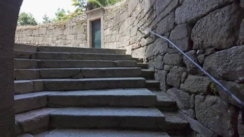 Stone tunnel giving access to narrow alleys in the medieval town of Tui, Stock Footage 286245365