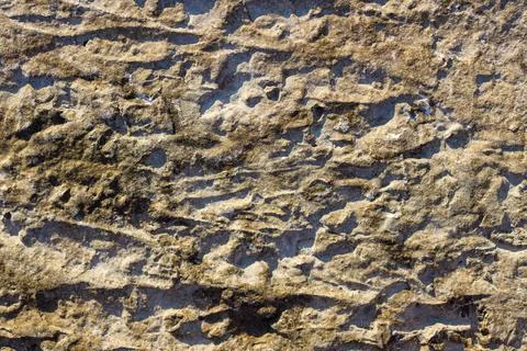 Stone uneven wall. weathered surface Stock Photos