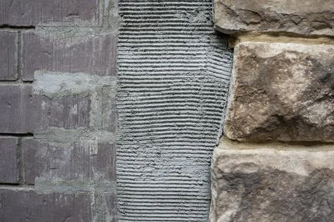 Stone Veneer Installation Process - Masonry Wall Construction Close Up Stock Photos