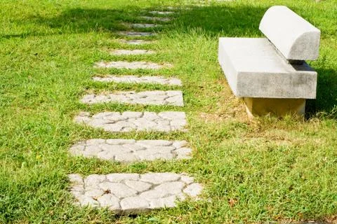 Stone walkway and stone bench 스톡 사진